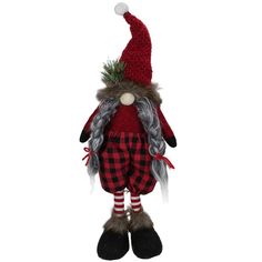 a red and black gnome stuffed animal with long hair, wearing plaid pants and a santa hat