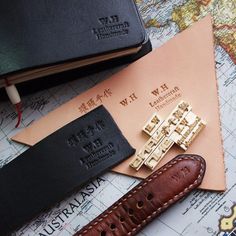 three different types of watch straps on top of a map with the names of countries