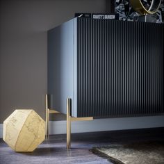 a room with a large radiator and a wooden object on the floor next to it