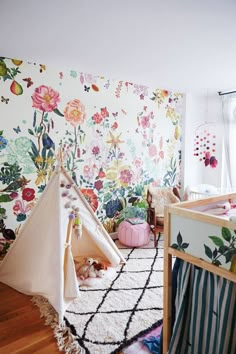 an instagramted photo of a child's room with flowers on the wall