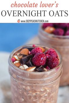 two jars filled with chocolate overnight oats and topped with raspberries, almonds, and nuts