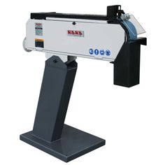 a machine that is sitting on top of a stand in front of a white background