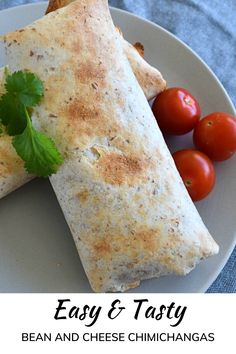 a white plate topped with two quesadillas and tomatoes