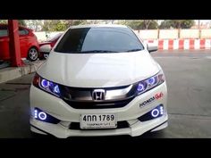 the front end of a white honda civic