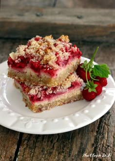 two pieces of strawberry crumb cake on a white plate