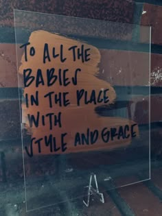 a sign that reads to all the babies in the place with time and grace on it