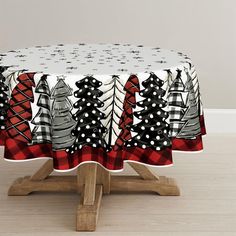 a christmas table cloth with trees on it