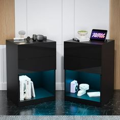 two black nightstands sitting next to each other