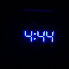 a digital clock with the time 11 45 on it's face in the dark