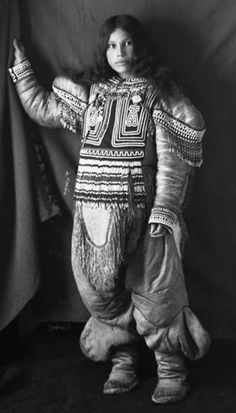 an old photo of a person dressed in costume