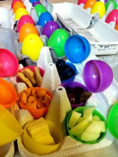 there are many different colored plastic cups on the table