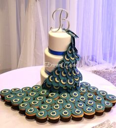 a cake decorated like a peacock on top of a table