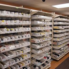 the shelves are filled with many different types of boxes and bins for storing items