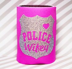 a pink can cooler with glitter police wife on it