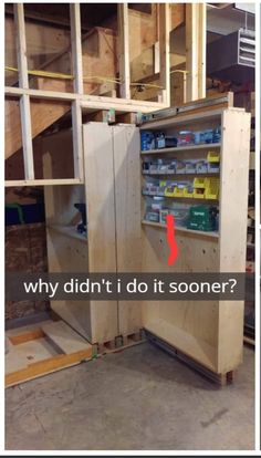 the inside of a storage cabinet with shelves and tools on it in a building under construction