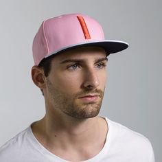 The Blinky is a classic six-panel, baseball-style cap in pink with a contrasting light blue brim and raised embroidery detail in orange. All March Caps feature top eyelets and an adjustable snap-back closure. Each cap comes with a hand-numbered card signed by the designer. Pink Fitted Hat With Curved Brim, Trendy Pink Flat Cap, Pink Fitted Hat With Flat Brim, Sporty Pink Cap, Pink Sporty Cap, Sporty Pink Trucker Hat With Curved Brim, Pink Snapback Hat For Sports, Pink Adjustable Flat Cap, Adjustable Pink Flat Cap