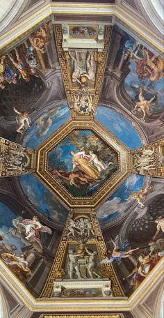 an ornate ceiling with paintings on it