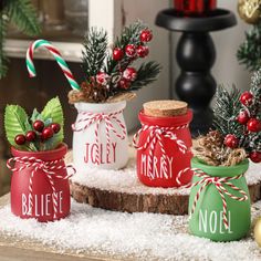 christmas jars decorated with candy canes and holly