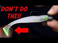 a person holding a fishing lure with the words don't do this