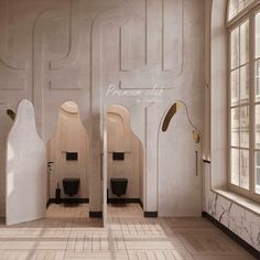 an empty bathroom with urinals and mirrors