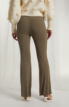 Cute, casual, and comfy, the Rosette Knit Flare Pants from Beverly and Beck are perfect for lounging. They have a mid-rise fit, a stretchy ribbed knit fabrication, rosette front detail, and flared leg openings. 


	Solid color pants
	10" rise
	30" inseam
	Ribbed fabric
	Mid-rise
	Elastic waistband
	Lace waist detail
	Rosette detail
	Lettuce edge hems
	Flared leg openings
	Model measurements: 5’9” height, 30” bust, 23” waist, 34” hip Sweatpants Women, Color Pants, Bodycon Dresses Casual, Solid Color Pants, Ankle Length Pants, Crop Top Blouse, Streetwear Women, Casual Streetwear, Swimsuit Tops