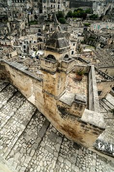 an aerial view of old buildings and cobblestone streets