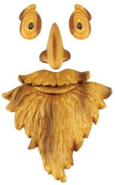 a wooden mask with two eyes and a beard