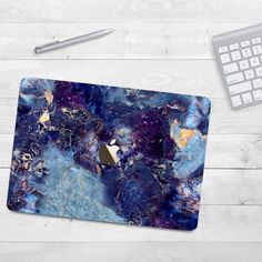 an image of a computer mouse pad with blue marble pattern on the front and side