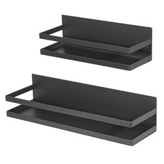 two black shelfs sitting next to each other on a white background, one is empty