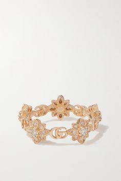 Gucci's 'Flora' ring is cast from 18-karat rose gold to resemble twisting flowers. The delicate blooms alternate with the brand's interlocking 'GG' moniker to form a band around your finger and shimmering diamonds are nestled at the heart of each one. Luxury Flower-shaped Jewelry With Rose Cut Diamonds, Luxury Flower Ring With Rose Cut Diamonds, Gucci Rose Gold Jewelry Gift, Gucci Rose Gold Jewelry For Gift, Gucci Fine Jewelry Yellow Gold Rings, Gucci Gold Fine Jewelry Rings, Gucci Yellow Gold Fine Jewelry Rings, Gucci Designer Rings In 14k Gold, Gucci Diamond Jewelry For Anniversary