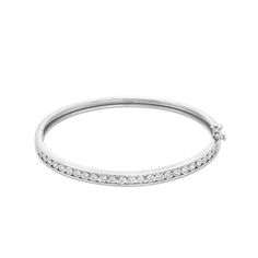 Build your collection of everyday style essentials with this simple and sleek diamond-lined bangle bracelet in sterling silver. Created in sterling silver Dainty round diamonds - each artfully set to enhance size and sparkle - line the open center between polished borders. Wear this style solo or stacked with other Radiant with 1/2 ct. t.w. of diamonds This bracelet measures 7.0 inches in circumference and secures with a box clasp. Platinum Bangle Diamond Bracelet, Platinum Bangle Diamond Bracelet With Diamond Cut, Platinum Diamond Cut Bangle Bracelet, Timeless Sterling Silver Channel Set Jewelry, Timeless Channel Set Sterling Silver Jewelry, Classic Oval Bangle With Diamond Accents, Platinum Diamond Bangle For Anniversary, Platinum Diamond Bangle Bracelet For Anniversary, Dazzling Brilliant Cut Bangle Jewelry