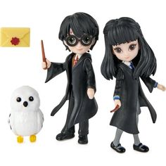 two harry potter action figures next to an owl