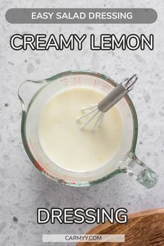 creamy lemon dressing in a glass measuring cup with the words, easy salad dressing creamy lemon dressing