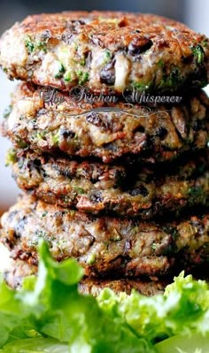 three burgers stacked on top of each other with lettuce