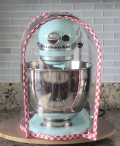 a blue kitchen aid mixer sitting on top of a counter