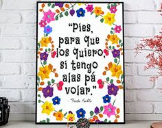 a white brick wall with colorful flowers on it and a quote written in spanish that says, pies para que los quieroos si tego