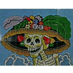 a tile mural with a skeleton wearing a sombrero on it's head