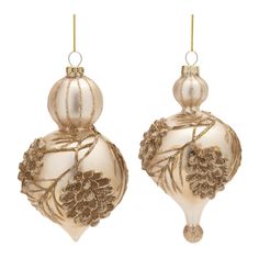 two white and gold ornaments hanging from strings