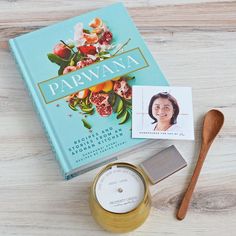 Parwana cookbook with gold candle, match set, wooden spoon, and profile card of the woman who poured the candle Gold Candles, Natural Soy Candles, Gourmet Gifts, Hand Poured Candle, Wooden Spoon, Made Goods