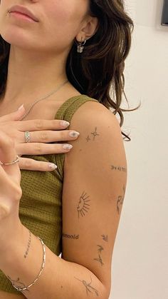 a woman with many tattoos on her arm