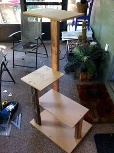 a wooden shelf sitting in the middle of a room