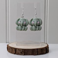 Whether a treat for yourself of a gift for a loved one, these cute elephant earring are perfect for expressing yourself.  The Earrings. These earrings are made of stainless steel and polymer clay. All of our earrings are made using silver coloured stainless steel hooks and eyelets as standard, however if you would prefer your earrings to be made using gold coloured stainless steel hooks and eyelets then we would be happy to do this at no extra cost.  Don't have your ears pierced but would love a Elephant Earrings, Quirky Earrings, Animal Earrings, Cute Elephant, Unusual Jewelry, Ear Jewelry, Earings Piercings, Polymer Clay Earrings, Statement Earrings