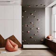 a living room with a rock wall and orange bean bag chair