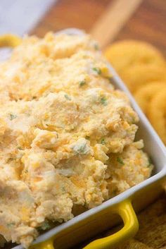 a close up of a bowl of food with crackers