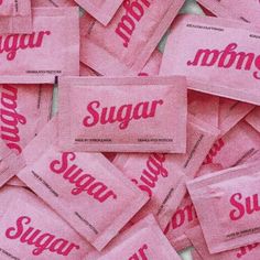 pink sugar packets with the word sugar on them