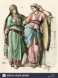 two women dressed in ancient clothing, one wearing a headdress and the other wearing a