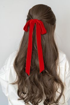 In holiday lights, a crimson glow, A bow of velvet steals the show. Rouge as bright as festive cheer, A timeless touch for all to wear. With every strand, it wraps in red, A joyful crown for each holiday thread. JAPANESE DOUBLE SIDED VELVET EMMA BOW BARRETTE with new colors just in time for the holidays ahead. Crafted from luxurious imported double-sided velvet, this bright red barrette brings a bold yet classic flair to any hairstyle. The rich, fluffy texture ensures a soft, comfortable feel, while the barrette clasp provides secure styling for all hair types. Whether for a formal occasion, holiday celebration, or simply to add a pop of color to your everyday look, this handcrafted bow will make you stand out with its stunning rouge tone. Each barrette is handmade with meticulous attentio Velvet Ribbon Hairstyle, Red Ribbon Hair, Red Hair Ribbon, Long Bow, Christmas Dance, Bow Barrette, Disney Outfit, Fluffy Texture, Ribbon Hairstyle