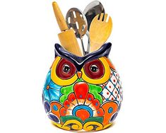 an owl shaped container with utensils in it