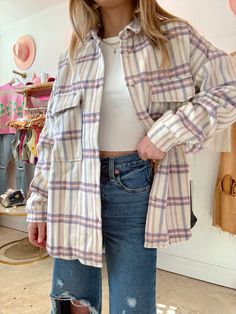 Our Lavender Latte Plaid Shacket is the cutest shacket to add to your collection! This shacket features lavender, mauve and cream plaid pattern, two front pockets, and a slit hem. Style this shacket with all your favorite jeans for the cutest outfits! Content: 100% Polyester Fit: TTS Model wearing size: Small Model sizing: 0-2 top, 24" bottoms | Height: 5'3" Lavender Latte, Cutest Outfits, Plaid Shacket, Choose Happy, Hem Style, Store Fronts, Free Spirit, Favorite Jeans, Plaid Pattern