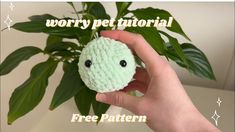 a hand holding a green crochet turtle toy with the words worry pet tutorial on it